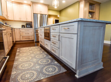 Kitchen renovation showing island cabinet with microwave