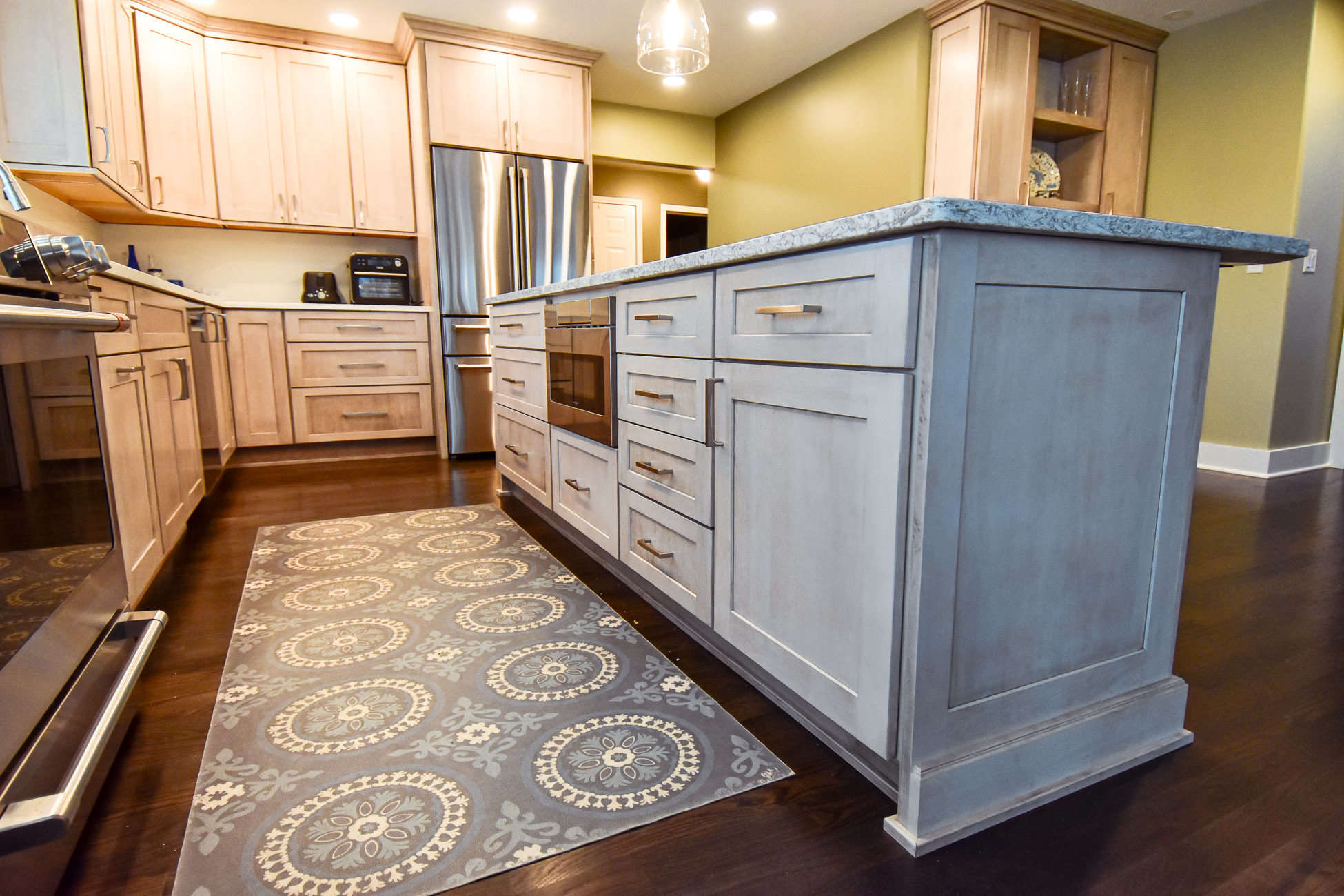 Kitchen renovation showing island cabinet with microwave